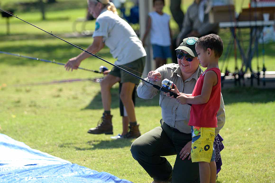 Kid learning how to fish