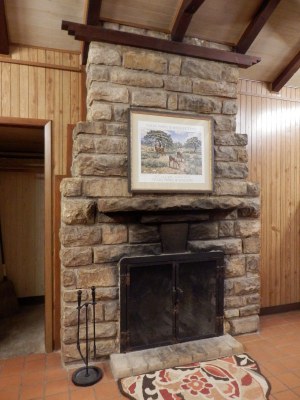Fireplace made of local stone in one of the cabins