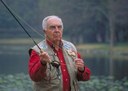 Fisherman holding rod