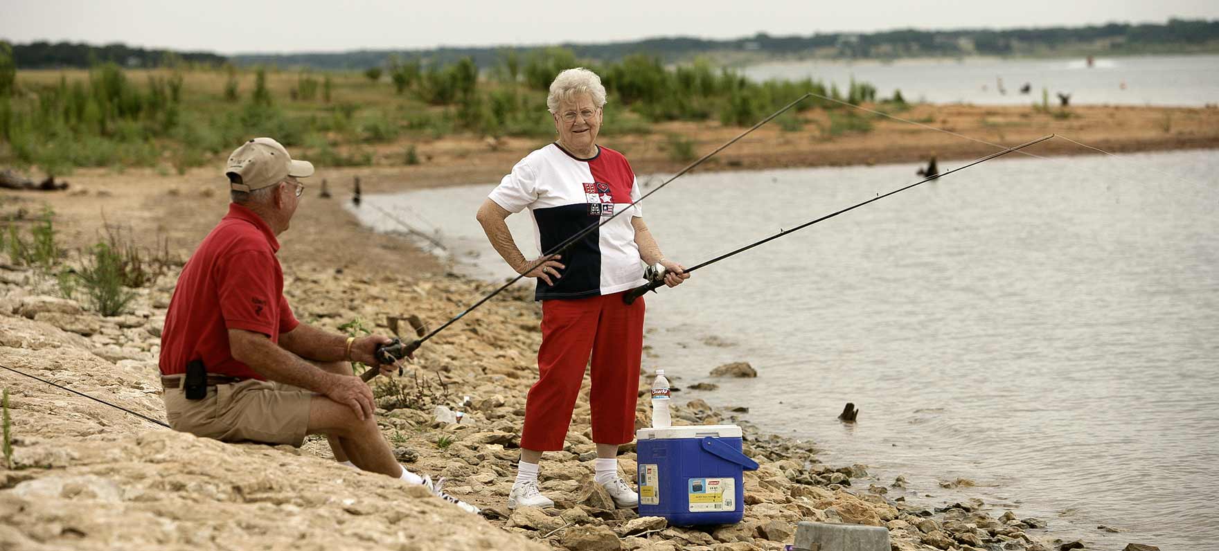 Older Couple Fishing From Shore