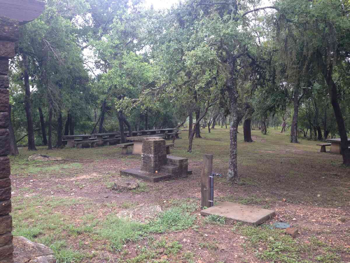 There are several picnic tables outside the Rec. Hall. 