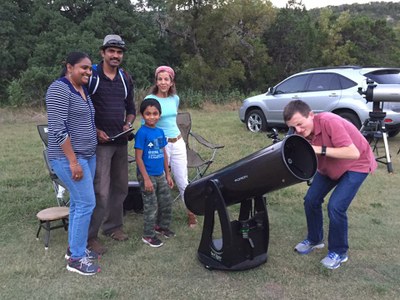 Looking through a telescope at Lost Maples State Natural Area. 