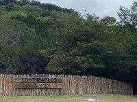 Lost Maples sign and front wood fence