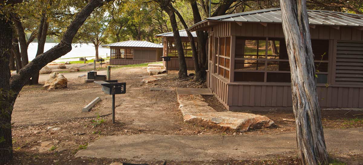 Screened shelters by the lake