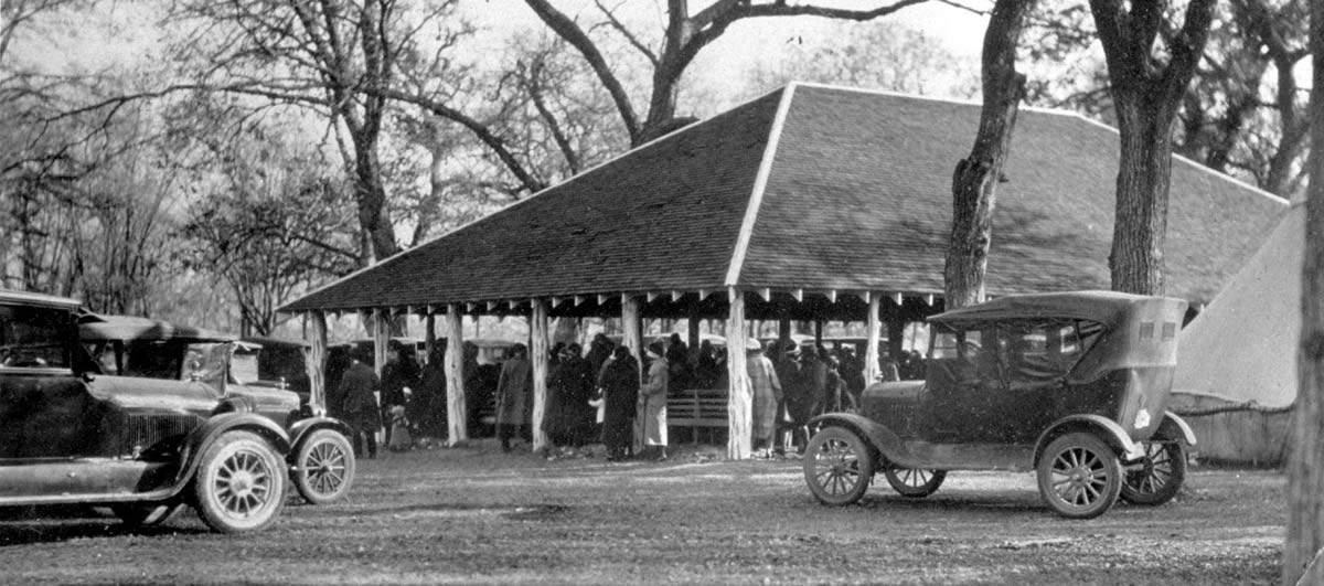 Historical photo of people gathered at a pavilion