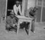 Three CCC men working on a table