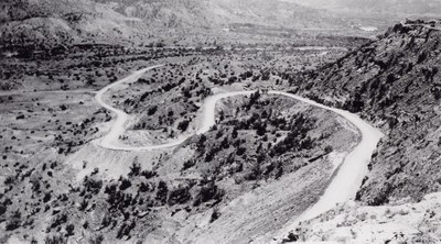 Winding road built by the CCC that goes down into the canyon .