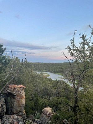 View from hill of creek through terrain