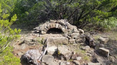 Rocks stacked with opening in the middle at ground level