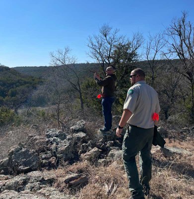 Men looking out over distant view