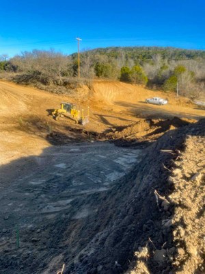Large ditch with a bulldozer