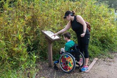 Boy in Wheelchair and Mom on Trail