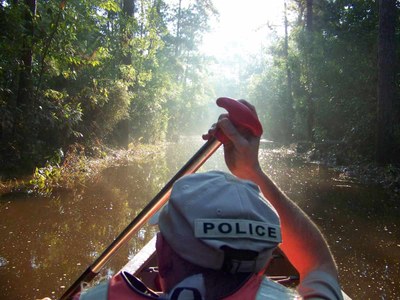 Canoeist paddling down Park Road 74