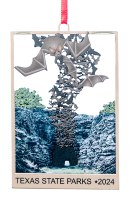 ornament showing bats coming out of a cave