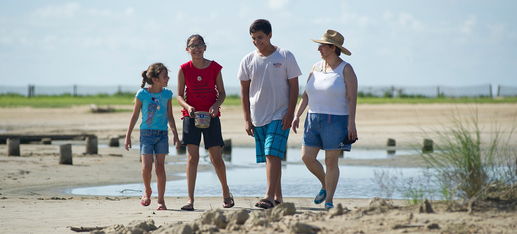 family walking in sand