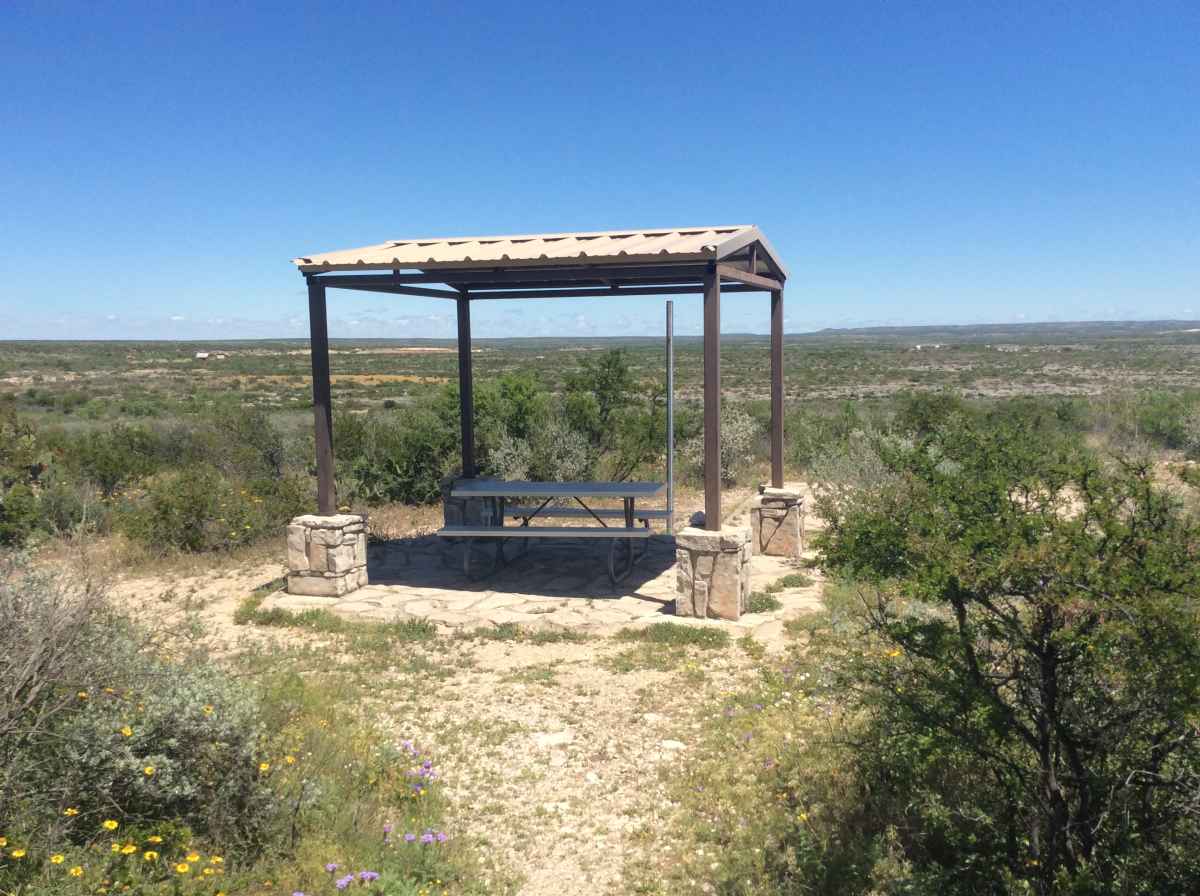 The picnic table and shade shelter at Campsite 9. 