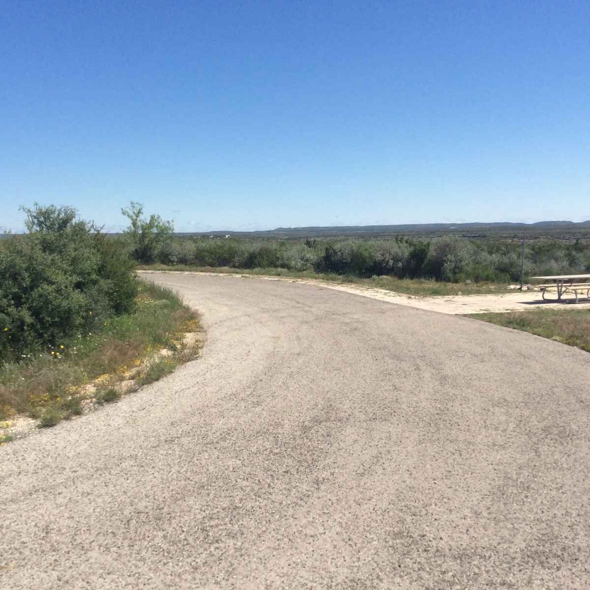 Campsite 43 has a paved area around the site.