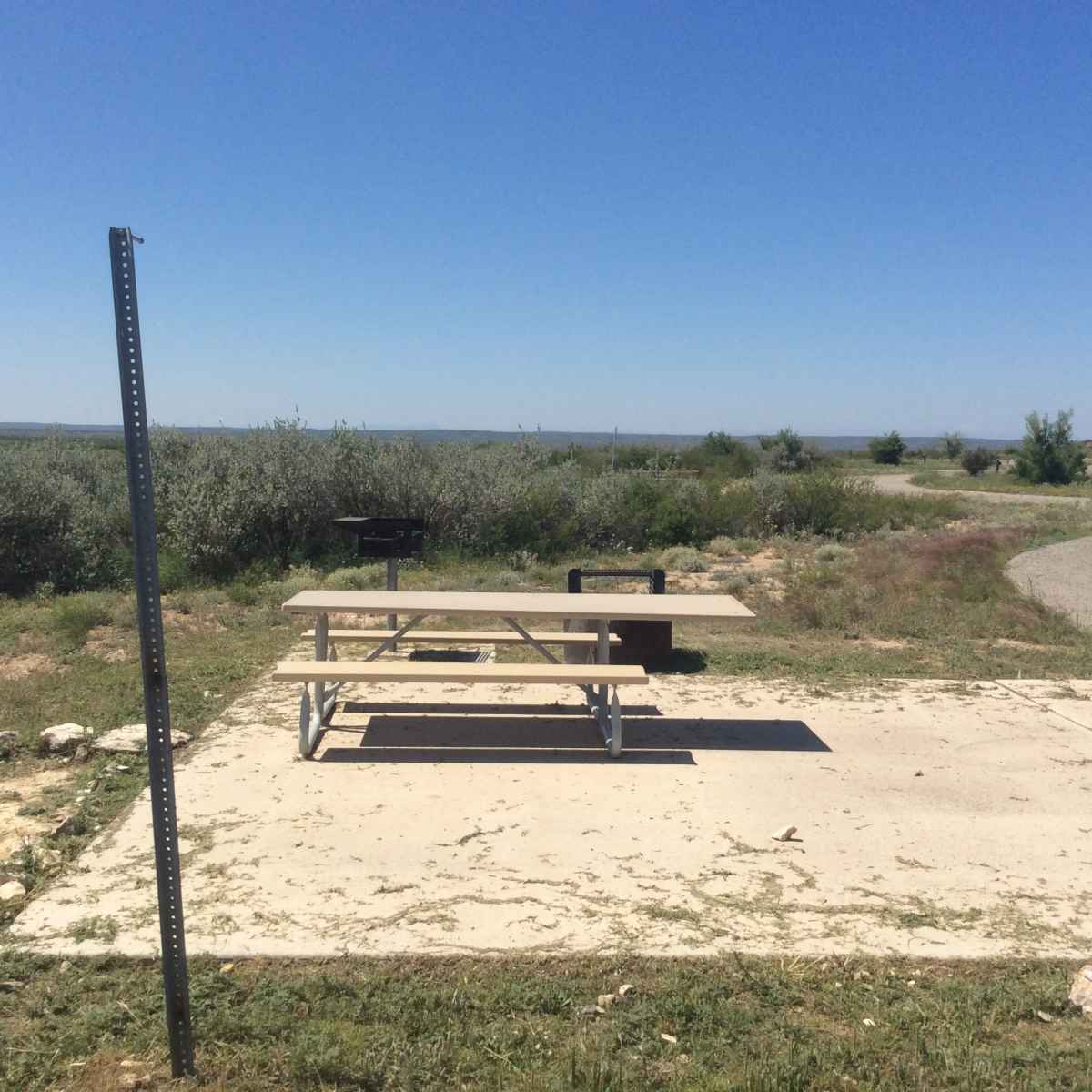 The picnic table and fire ring at Campsite 43 is designed to be usable in a wheelchair. 