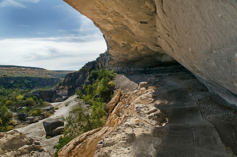 Cliff overhang with view to the distance