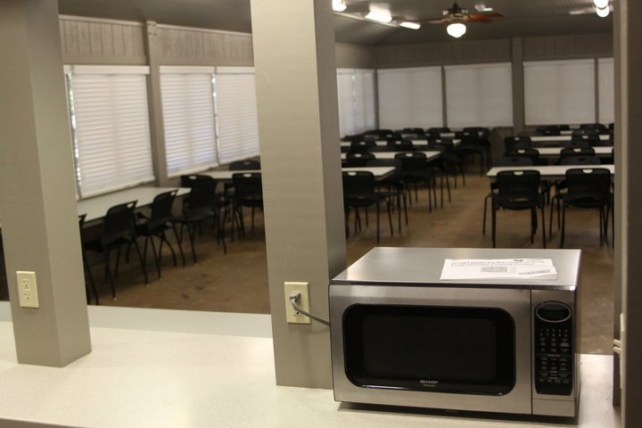 the kitchen serving counter looks into the dining area.