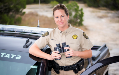 Brandi Reeder by Game Warden Truck.PNG