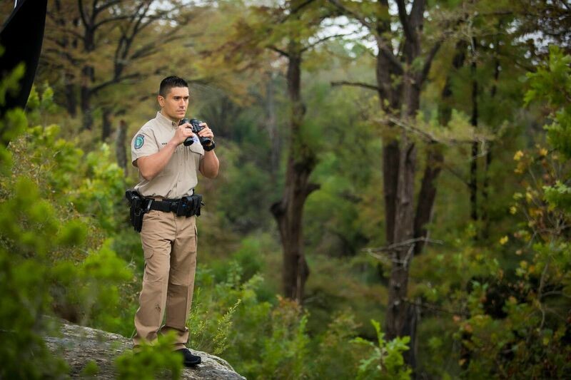 Game Warden holding binoculars.jpg