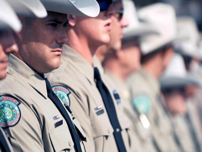 Game Wardens standing in line at Funeral.PNG