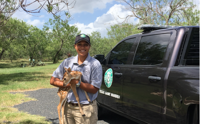 Intern Holding a Deer.PNG